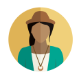 A woman in a hat wearing a necklace and blazer